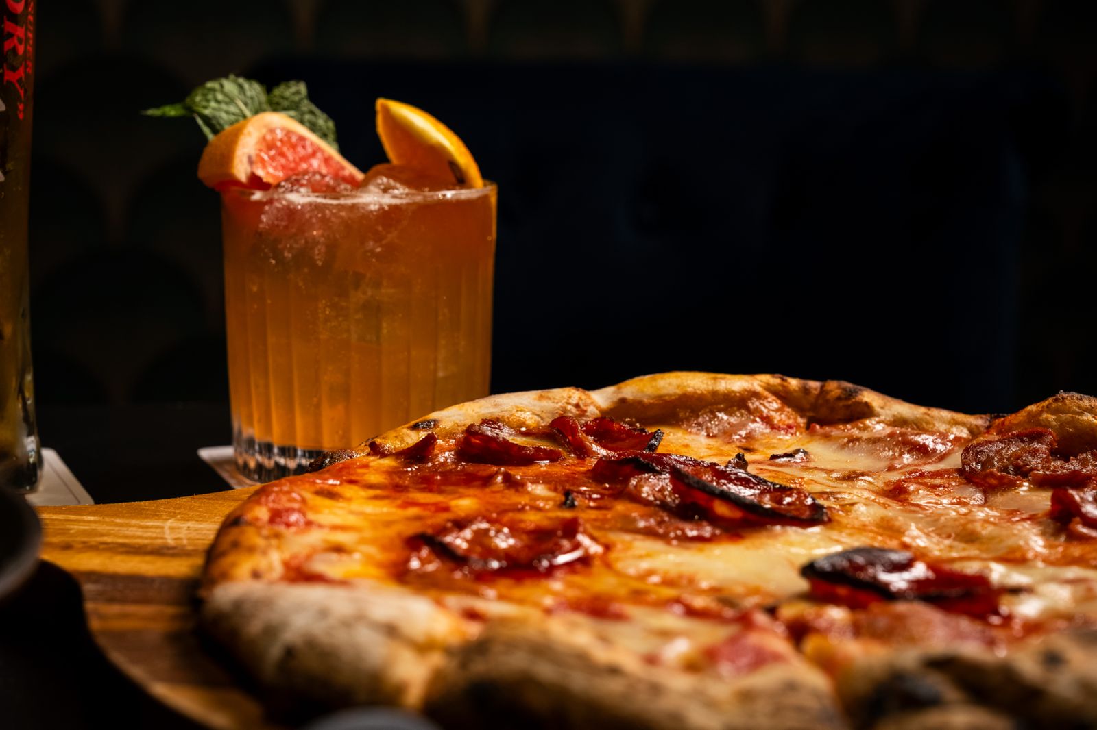 Pizza and drinks on the counter
